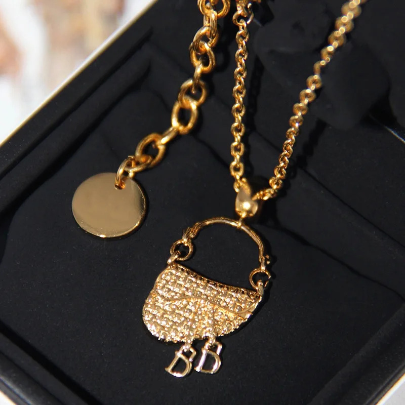 YISON フランス製高級金メッキ、サドルバッグ型ペンダント - Luxury Bags In Sale のレビューと価格